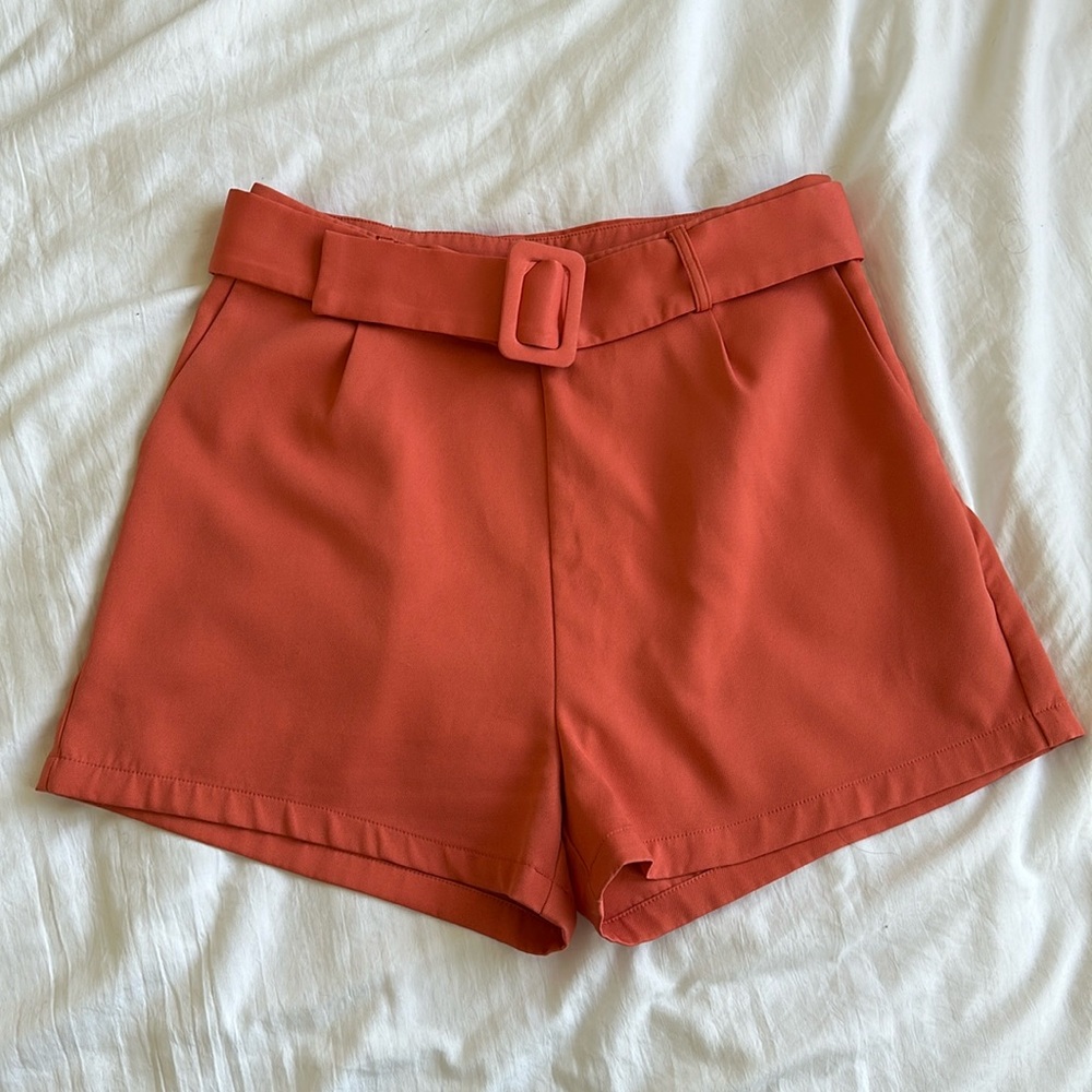 Coral salmon colored high waisted shorts with matching belt